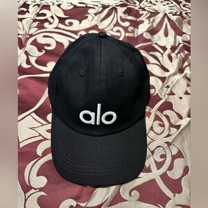NWOT, never used Alo Yoga black cap with white ALO letters/logo